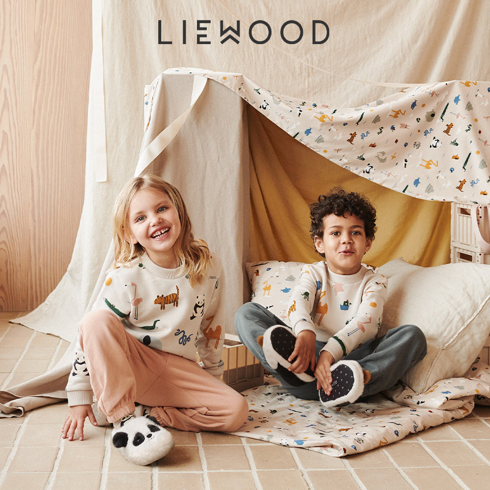 Marcia May Mini - Image of two children in a blanket fort with Liewood Logo