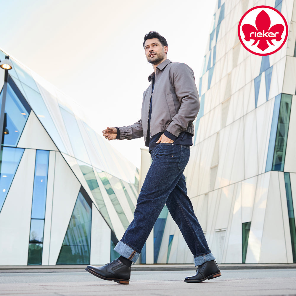 Mens at Marcia May - Image of a man wearing Rieker shoes with the Rieker logo