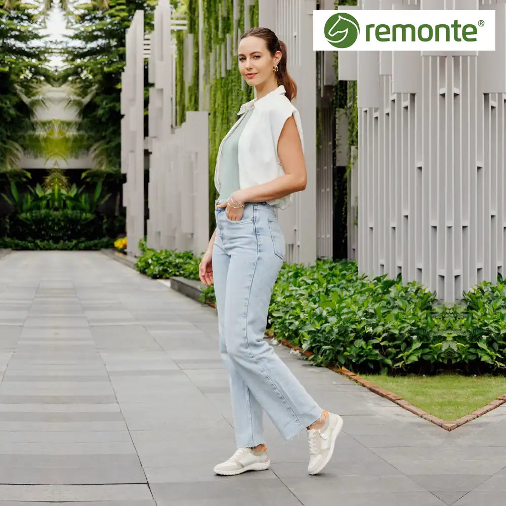 Womens at Marcia May - Image of a women wearing Remonte shoes with the Remote logo
