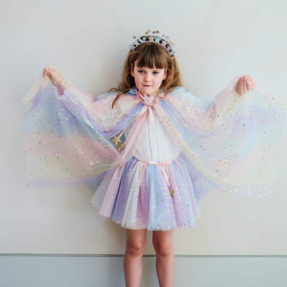 girl dressed up in a sparkly outfit