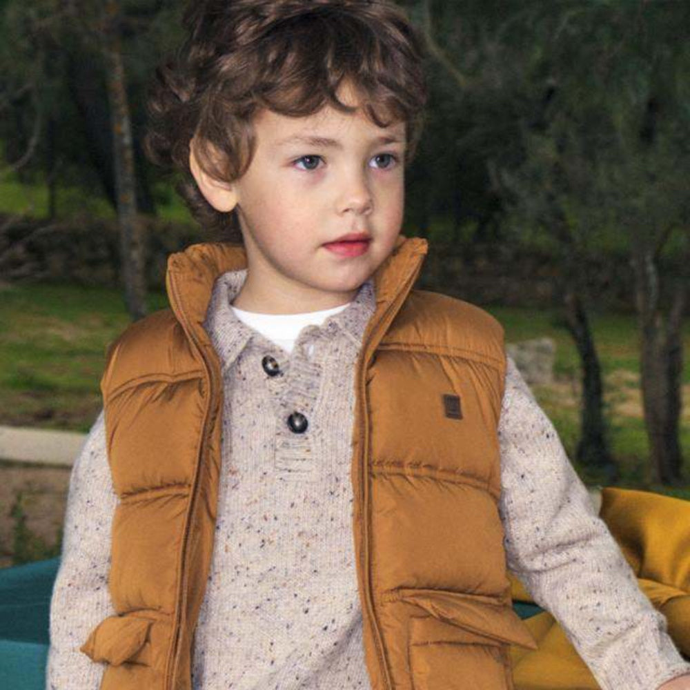 child wearing a jumper and gillet